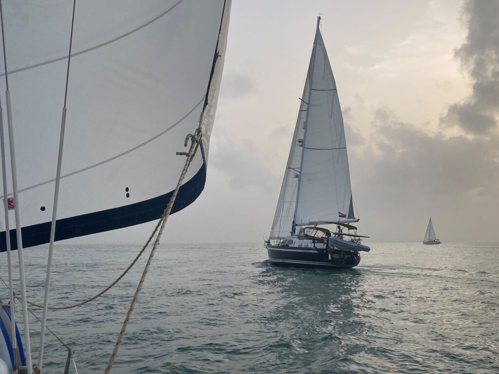 Sailing in the Bijagós. The Duch yacht Bluehemian in the foreground.